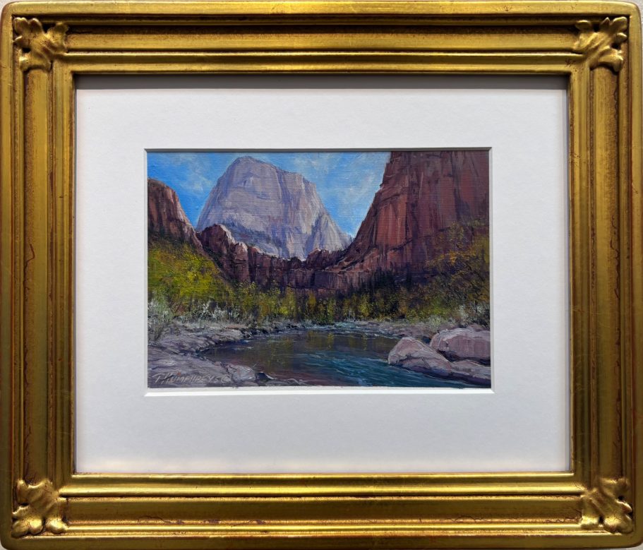 Zion Near Big Bend A framed painting of a mountainous landscape with a river and trees.