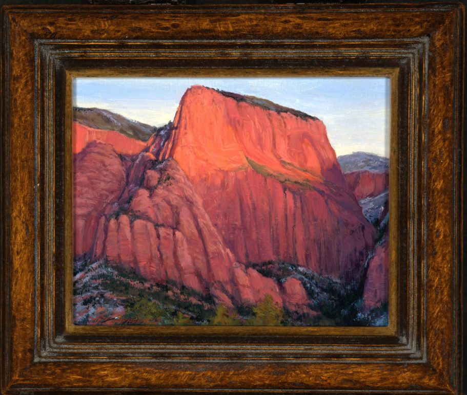 Last Light on Kolob Vibrant red rock formations under a clear sky, framed in an ornate wooden frame.