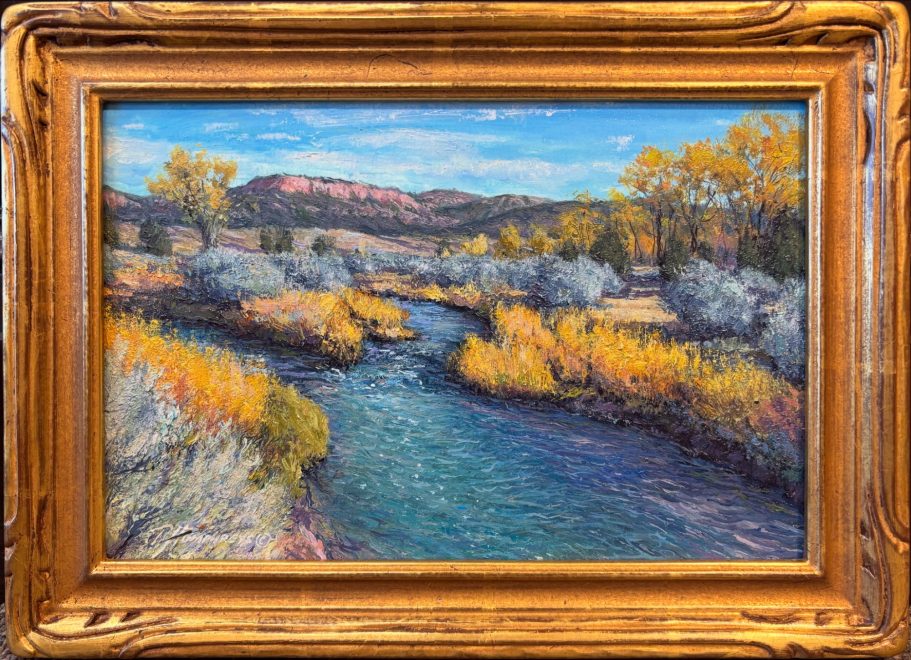 A serene landscape featuring a winding river surrounded by colorful autumn foliage.