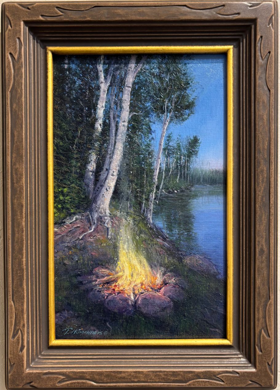 Lakeside Campfire A serene lakeside scene with a campfire surrounded by trees in a wooden frame.